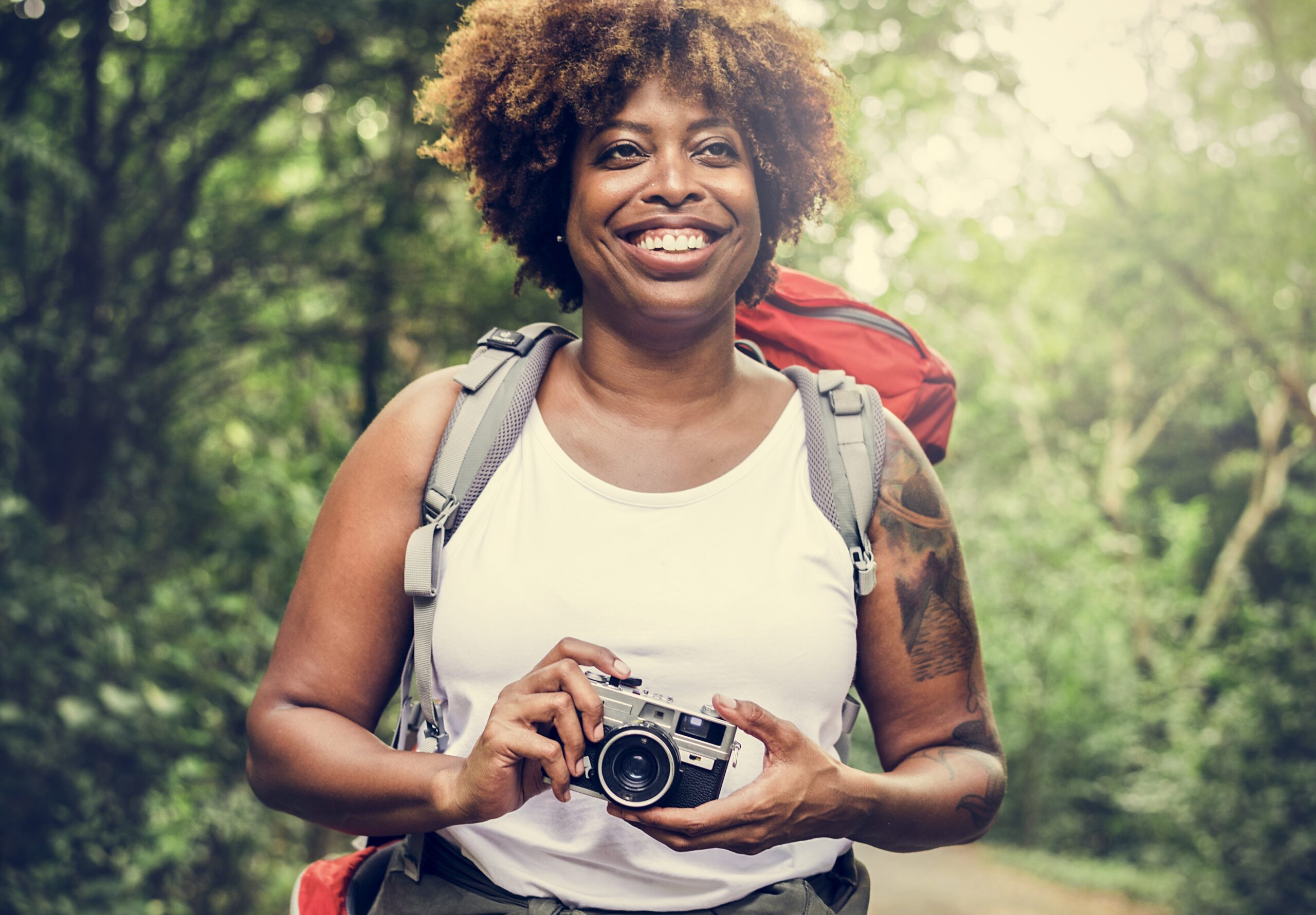 Woman hiking with a camera