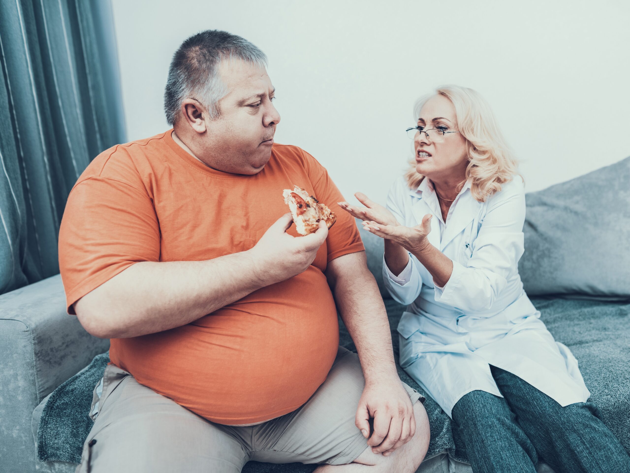 person in a larger body experiencing weight stigma by being bullied for eating pizza 